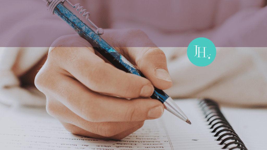 Close up visual of a hand holding a blue pen, writing in a spiral bound notebook - 4 Steps to Stop Feeling Overwhelm and Set yourself up for success in 2025