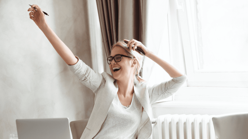 woman celebrating the win - Design Your Career