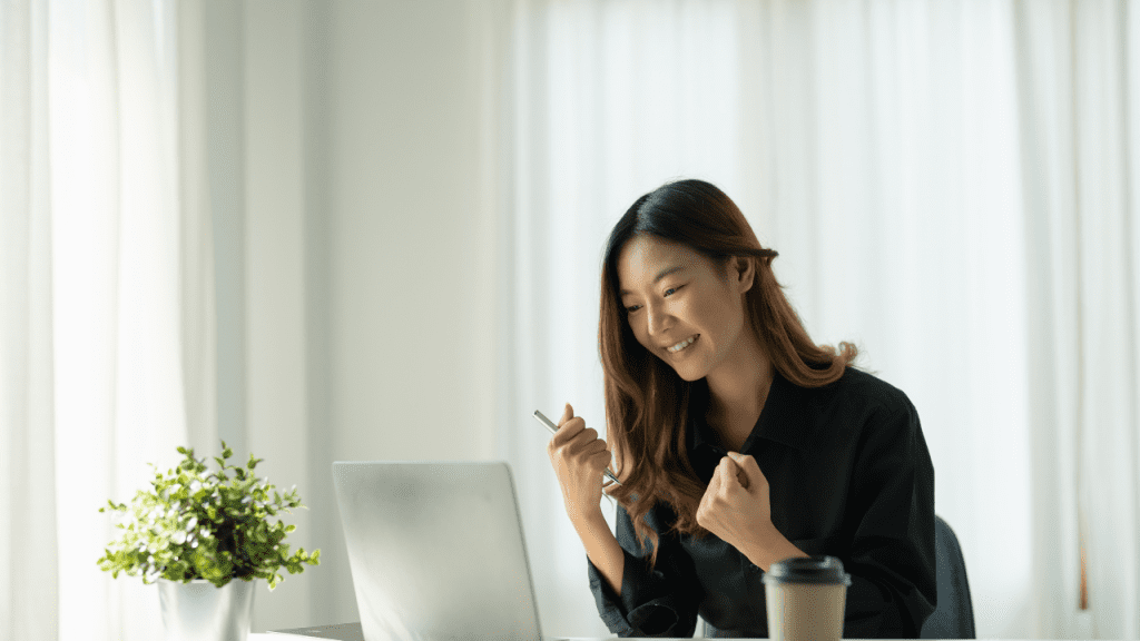 Happy Business Woman at her Desk - work-life balance for high achievers